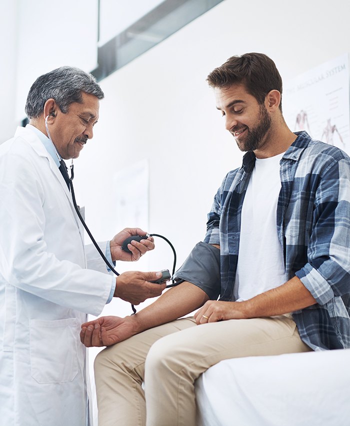 Man getting his blood pressure checked in doctor’s office