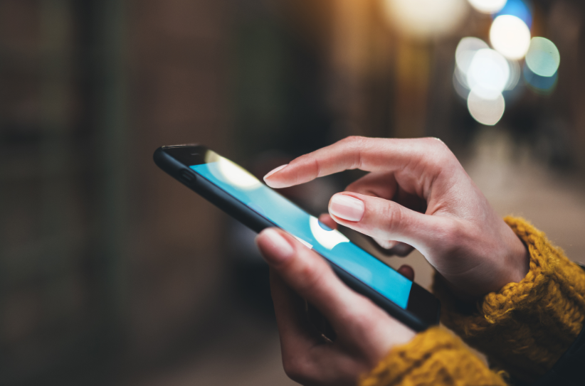 Hand holding mobile phone